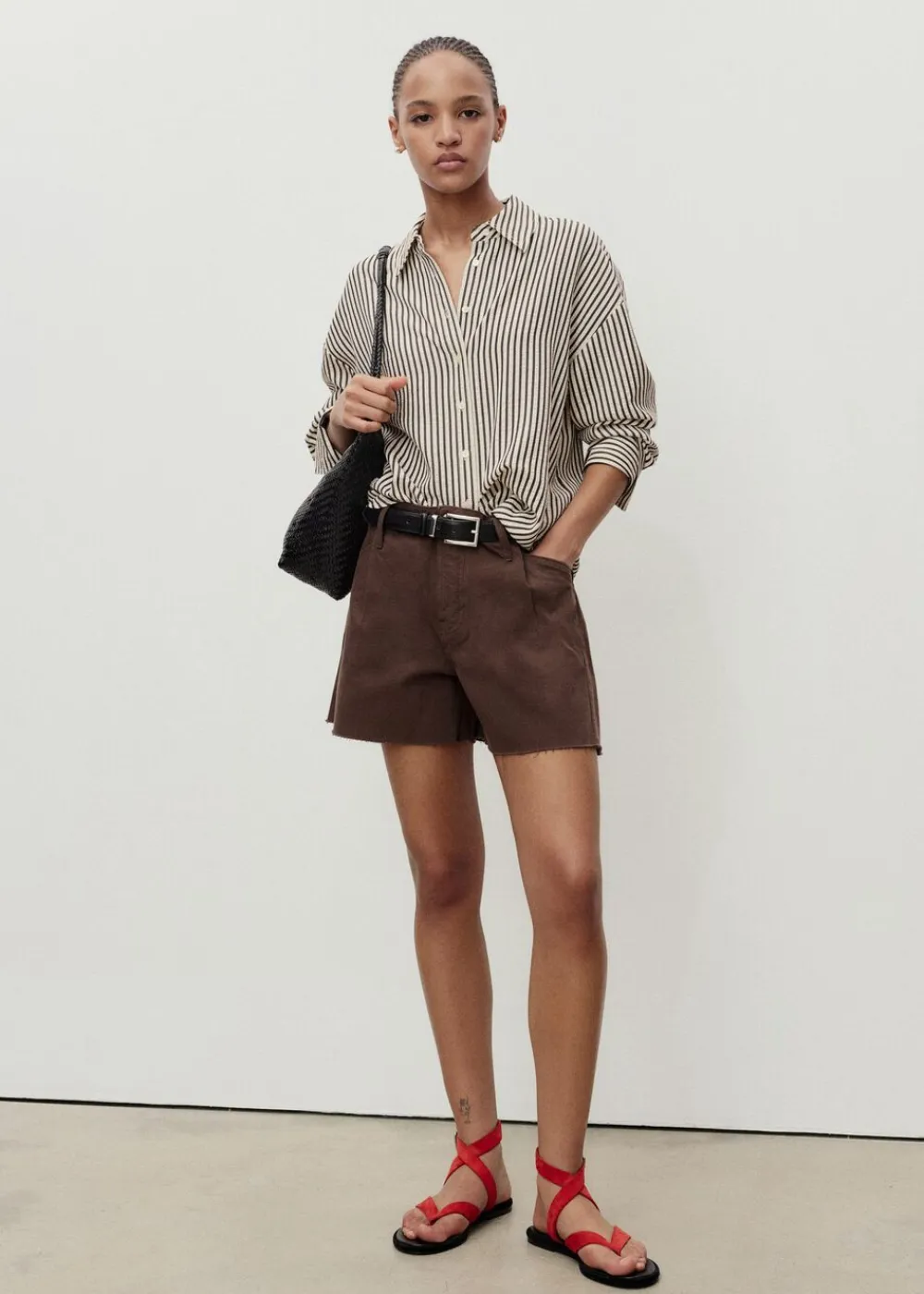 Dame MANGO Denim shorts with frayed hem and pl